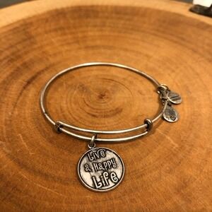 Alex and Ani sliver bangle with a Happy charm!